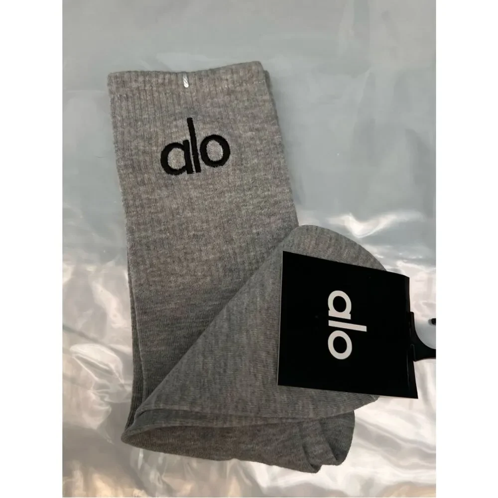 ALO Yoga unisex half crew understated socks in gray embroidered logo